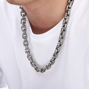 Close-up of vintage hammered texture steel chain necklace on model for men
