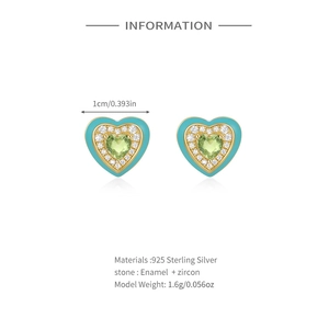 Detail of heart earrings in 925 sterling silver with green zircon and enamel inlay
