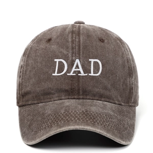Vintage washed dark brown baseball cap with DAD embroidery on a white background