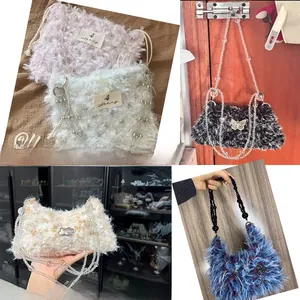 Detail of plush faux fur handbag with elegant beaded strap and butterfly metal charm