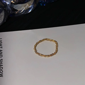 Sparkling 18K gold plated titanium steel beaded ring with textured metallic finish