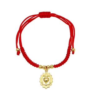 Red braided rope bracelet with gold sacred heart pendant and adjustable drawstring