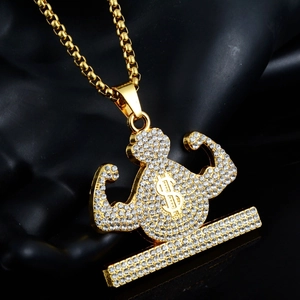 Detailed close-up of hip hop pendant featuring muscular figure with dollar sign and diamonds