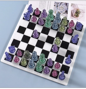 Macro shot of colorful transparent crystal chess pieces on a classic 8x8 chessboard