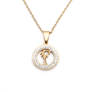 Detail view of gold coconut tree pendant with white rhinestones on a fine chain