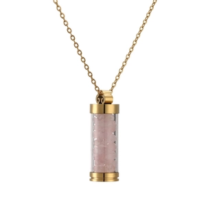 Golden perfume bottle pendant necklace with pink crystal stones on white background