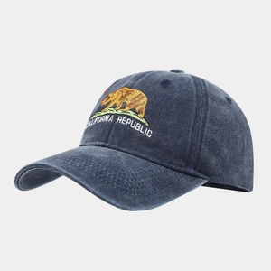 Detail of California Republic bear embroidery on washed navy blue cotton baseball cap
