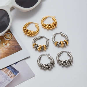 Minimalist 18K gold and silver stainless steel multi-ring hoop earrings on white surface