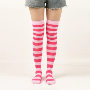 Pink and light pink striped over-knee high socks worn by a model on white background
