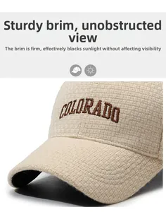 Detail of Colorado letter embroidery on beige textured fabric baseball cap with curved brim