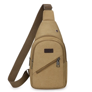 Minimalist khaki canvas sling bag with adjustable strap and sport tag on white background