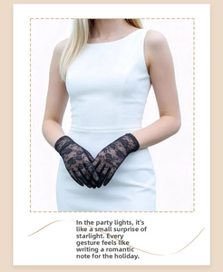 Close-up of elegant black lace gloves with floral patterns and delicate hollow-out details