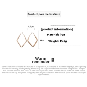 Detail view of rose gold geometric rhombus hoop earrings with 4.5cm width and 6cm height