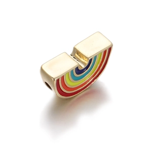 Detail of a U-shaped gold enamel charm with a vibrant rainbow pattern for DIY jewelry