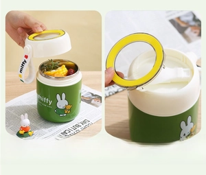 Detail of insulated Miffy food jar showing stainless steel interior and folding spoon