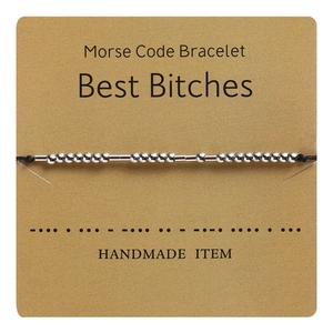 Detail of Morse Code Bracelet with silver beads on black cord and Best Bitches card