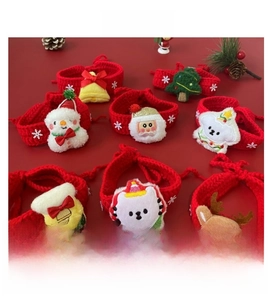 Variety of handmade crochet Christmas pet collars with Santa and reindeer ornaments