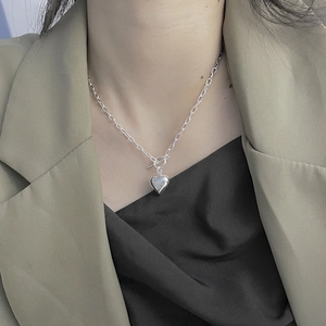 Elegant 925 sterling silver heart necklace with OT toggle clasp on a female model