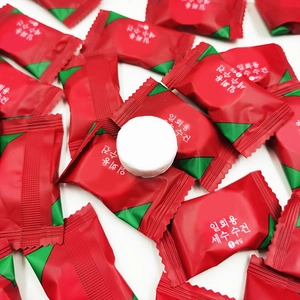 Macro detail of portable disposable compressed facial towels with individual packaging