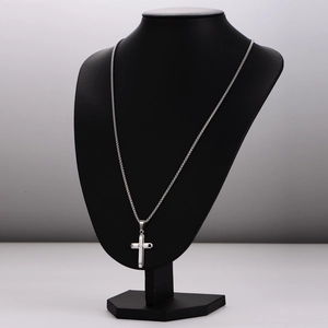Minimalist double-layer stainless steel necklace with textured cross pendant on model
