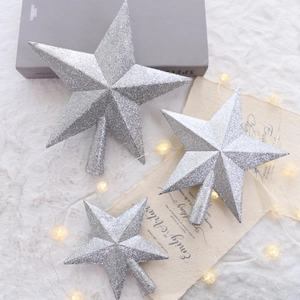 Three-piece set of silver glitter star Christmas tree toppers in various sizes for holiday