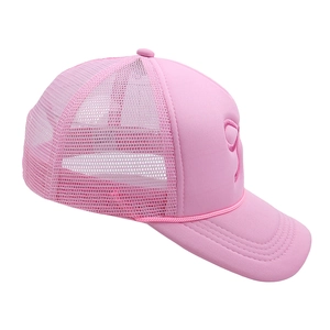 Detail of pink truck cap featuring breathable mesh and delicate bow embroidery on front