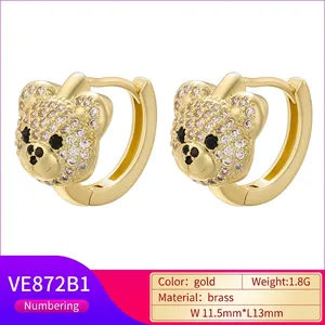Sparkling gold teddy bear hoop earrings with white micro-pave crystals and black stone eyes