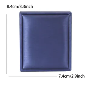 Navy blue jewelry gift box with silk texture and dimensions of 8.4 x 7.4 cm
