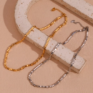 Detail of 18K gold and silver plated cube bead necklaces with adjustable lobster clasp