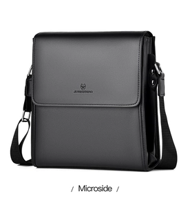 Microside view showing black pebble leather texture and metal buckle on men's messenger bag