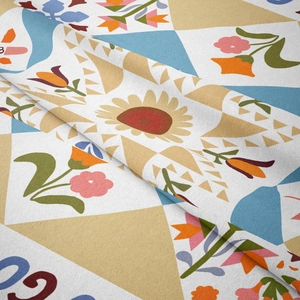 Close-up detail of soft textured bohemian tapestry with sunflower and geometric prints