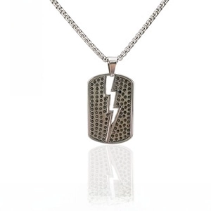Macro view of silver square tag bracelet with lightning cutout and honeycomb texture