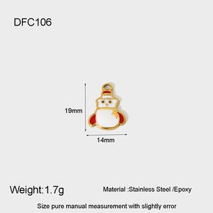 Detail view of gold stainless steel snowman charm with red and white epoxy finish