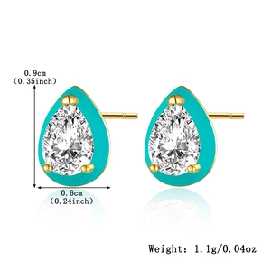 Macro detail of teardrop S925 silver stud earrings with green enamel and clear gemstone