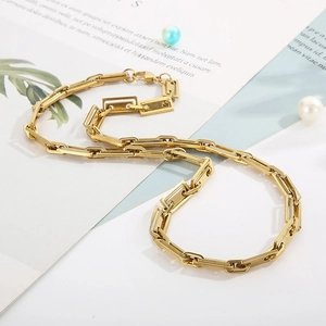 Golden rectangular link chain necklace in stainless steel on a white background