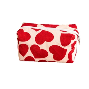 Corduroy travel cosmetic bag with red heart pattern and top zipper closure