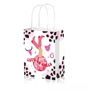 Close-up of disco cowgirl gift bag featuring cow print details and pink cowboy boot design