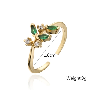 Macro shot of 18K gold ring with green zircon plant shape, size 1.8cm and 3g weight