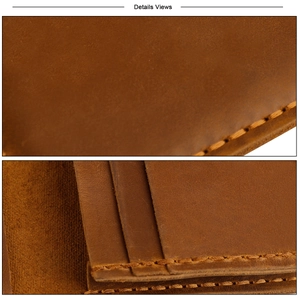 Close-up of vintage brown crazy horse leather card holder with detailed yellow stitching