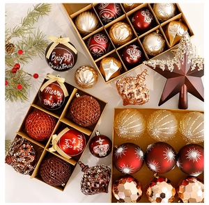Detail of Christmas ornament set with glitter balls and star topper in wooden box