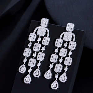Elegant silver tassel earrings with tiered zircon stones for a luxurious statement look