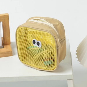 Detail of khaki mesh makeup bag with cute googly eyes embroidery and top zipper