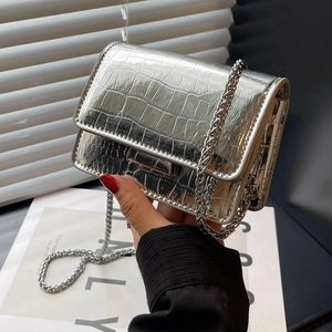 Silver crocodile pattern chain bag with high-shine mirror finish and metal strap