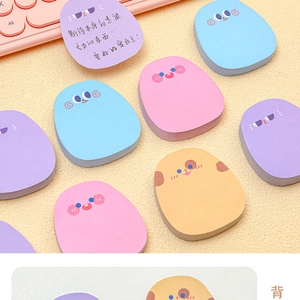 Detailed view of pebble-shaped macaron sticky notes with cute animal face emojis