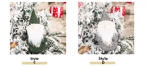 Detail view of handmade Christmas forest gnome ornaments with long white beards and wooden buttons