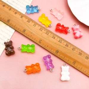 Detailed view of colorful 2cm resin gummy bears with metal loops for DIY jewelry making