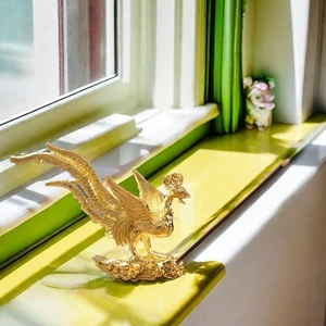 Golden phoenix incense holder with intricate feather details on a cloud-patterned base