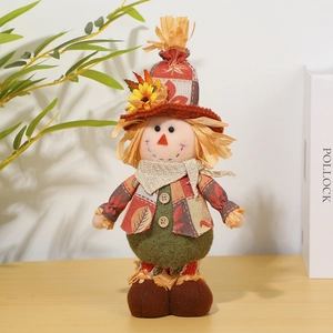 Detail of harvest scarecrow doll with sunflower hat and plaid scarf for fall decor