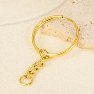 Detail of 18K gold plated stainless steel key ring with short chain and connector link