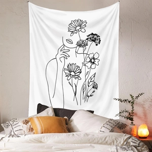 Detailed close-up of minimalist line art tapestry featuring floral and female profile motifs